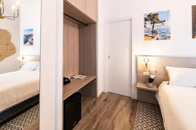 Letto o letti in una camera di Santa Teresa luxury rooms