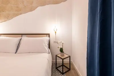 Letto o letti in una camera di Santa Teresa luxury rooms