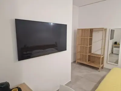 TV o dispositivi per l'intrattenimento presso Neapolitan Skyscraper Suites