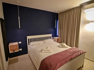 Letto o letti in una camera di Bovio 33 Napoli art apartment