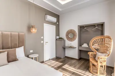 Letto o letti in una camera di ATAROOMS Suites Napoli