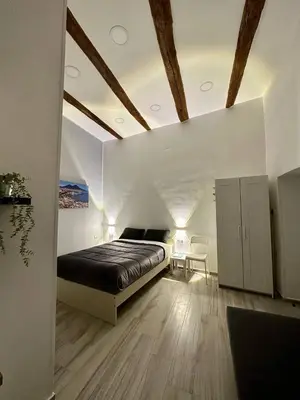 Letto o letti in una camera di Casa We Love Napoli