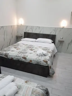 Letto o letti in una camera di CARMELA HOUSE