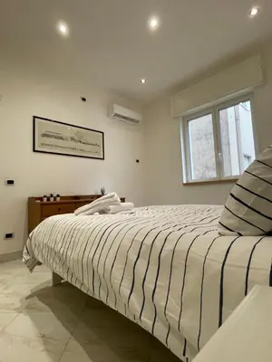 Letto o letti in una camera di Napoli Hub