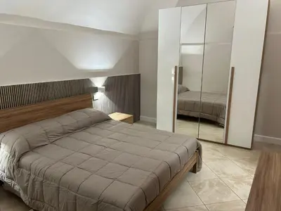 Letto o letti in una camera di TERRAZZINO CORRERA GUEST HOUSE