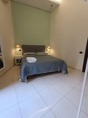 Letto o letti in una camera di Residenza GeRi - Suite and Home Napoli Centro