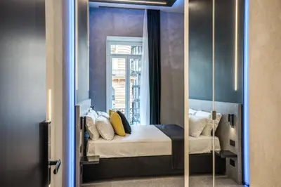 Letto o letti in una camera di Gallery Experience Napoli