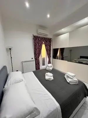Letto o letti in una camera di Napoli inn station