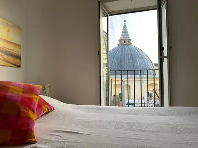 Letto o letti in una camera di Casa Rossini Apartments