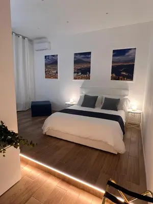 Letto o letti in una camera di Astorya e’ Napoli