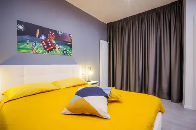 Letto o letti in una camera di Napoli Games Apartments by Dimorra