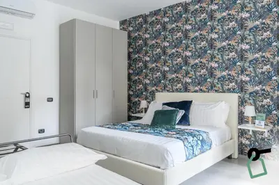 Letto o letti in una camera di Hotiday Room Collection - Napoli Sant'Arcangelo