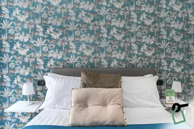 Letto o letti in una camera di Hotiday Room Collection - Napoli Sant'Arcangelo