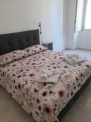Letto o letti in una camera di Anima partenopea