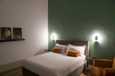Letto o letti in una camera di La casa di Nelly Boutique Apartment Napoli