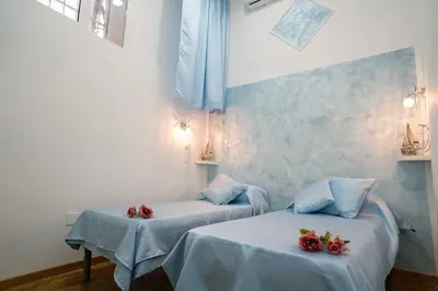 Letto o letti in una camera di New In! Rose a Santa Lucia