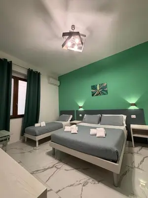 Letto o letti in una camera di B&B CADIFRA Portapiccola