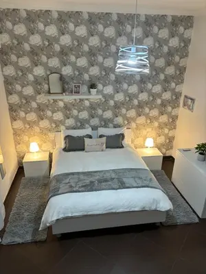 Letto o letti in una camera di Napoli Olè suite