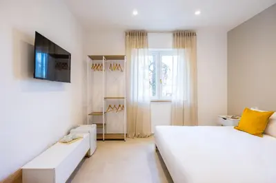 Letto o letti in una camera di Montesanto View Rooms by Wonderful Italy