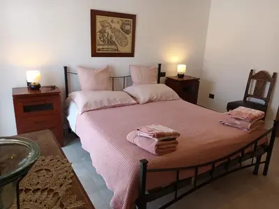 Letto o letti in una camera di Casa Vacanze nel Cuore di Napoli