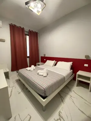 Letto o letti in una camera di CADIFRA Suite Napoli Toledo