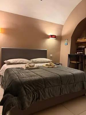 Letto o letti in una camera di Casa Carmelì