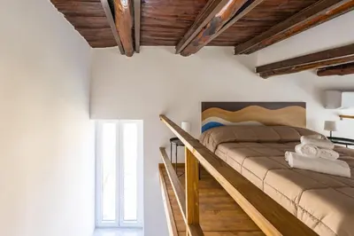 Letto o letti in una camera di Carrozzieri Nest at Historical Center