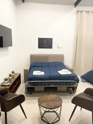 Letto o letti in una camera di Napolidays Rua Catalana Apartment