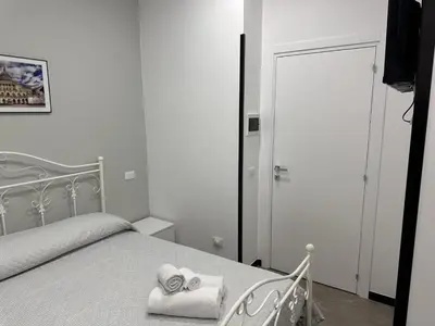 Letto o letti in una camera di le camere di anna e grazia