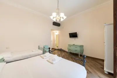 Letto o letti in una camera di Plebiscito Rooms