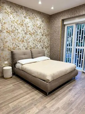 Letto o letti in una camera di 280 mt dalla metro The Mox Luxury Apartament