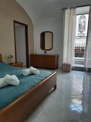 Letto o letti in una camera di AUTENTICA NAPOLI HOME