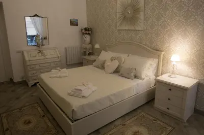 Letto o letti in una camera di La Regina di Spaccanapoli