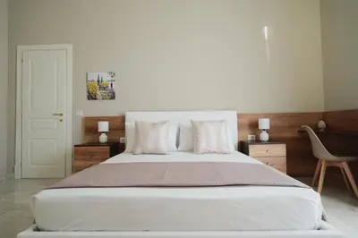 Letto o letti in una camera di ENJOY Napoli - Exclusive Apartment