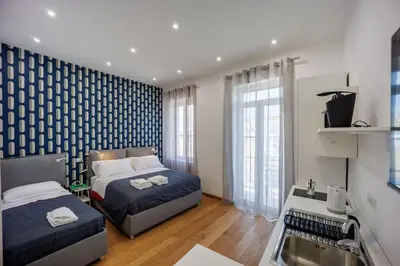 Letto o letti in una camera di House in Decumani Entire Apartment By HouseinNaples