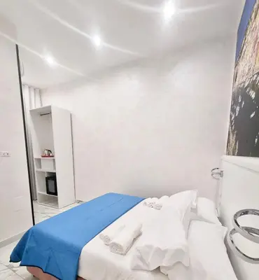Letto o letti in una camera di DUOMO MIRADOIS 152 NAPOLI