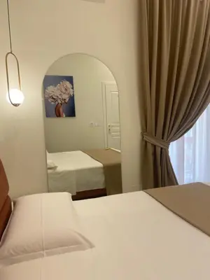 Letto o letti in una camera di Dimora Don Pasquale Napoli
