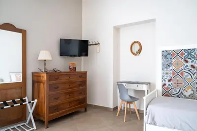 Letto o letti in una camera di Tinellari Rooms