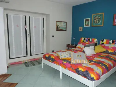 Letto o letti in una camera di Sinfonia di Napoli