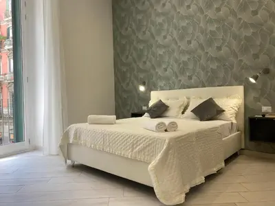Letto o letti in una camera di LudBen Dante B&B