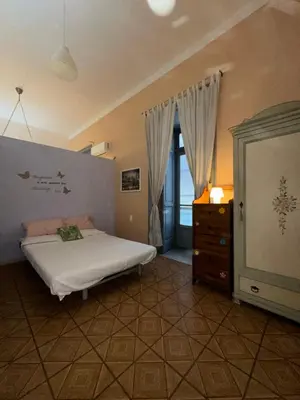 Letto o letti in una camera di EAT SLEEP &LoVE