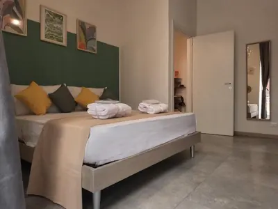 Letto o letti in una camera di Vinyls' Green Home - Toledo Centro Storico