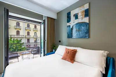 Letto o letti in una camera di MH SUITES Plebiscito