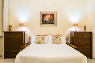Letto o letti in una camera di Homely City Apartment by Wonderful Italy
