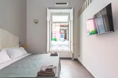 Letto o letti in una camera di Napoli Relax Rooms Chiaia - Mergellina - Posillipo