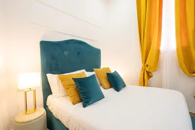 Letto o letti in una camera di Random Holidays Napoli By Dimorra