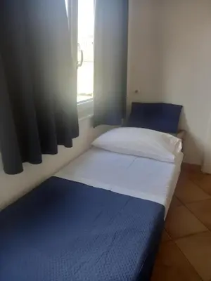 Letto o letti in una camera di 99 Scalini