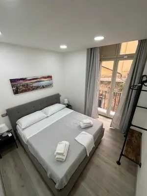 Letto o letti in una camera di NA City Rooms