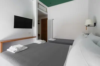 Letto o letti in una camera di Weaver Suites By Dimorra