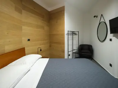 Letto o letti in una camera di ResidenzaScaleNapoletane